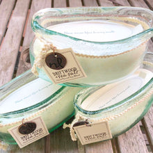Load image into Gallery viewer, recycled sea-green glass  vessel with soy candle in Driftwood Sea Salt fragrance.  Beachy vibe, 7" length, Windward Boat candle finished with nautical rope trim;
